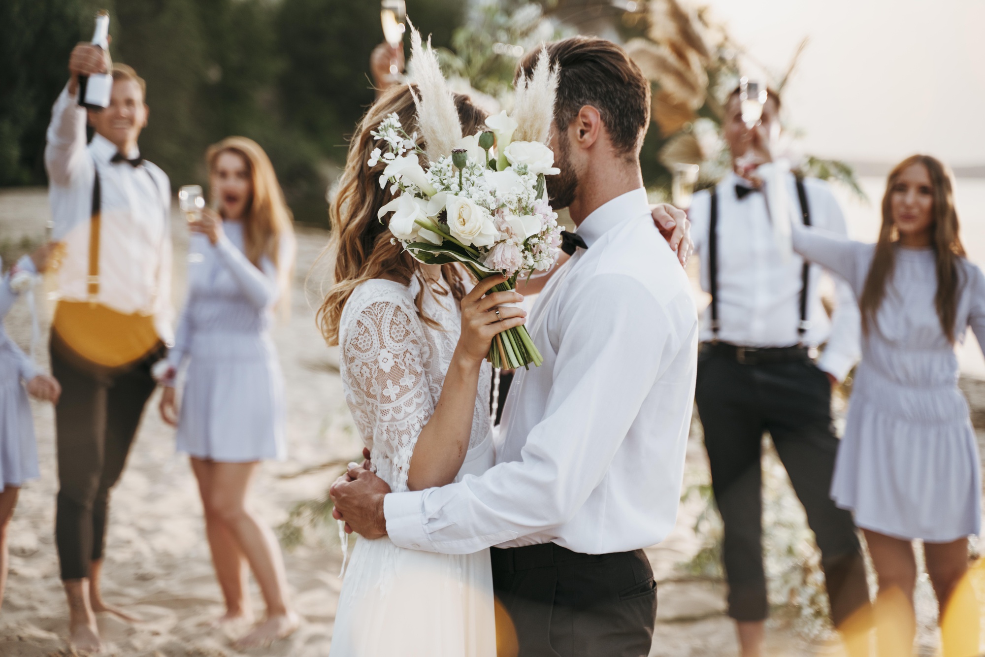 bride-groom-having-their-wedding-with-guests-beach